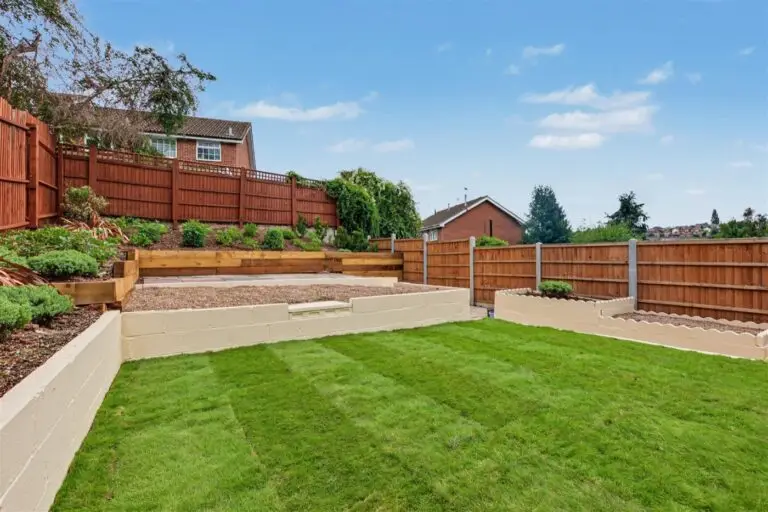 Landscaped back garden with new lawn, rebuilt raised beds and new fencing