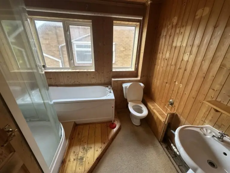 Old wood-panelled bathroom before the Gedling refurbishment