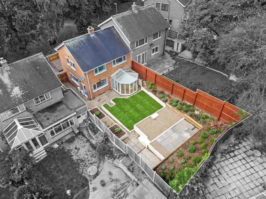 Aerial view of the landscaped rear garden with new lawn and fencing